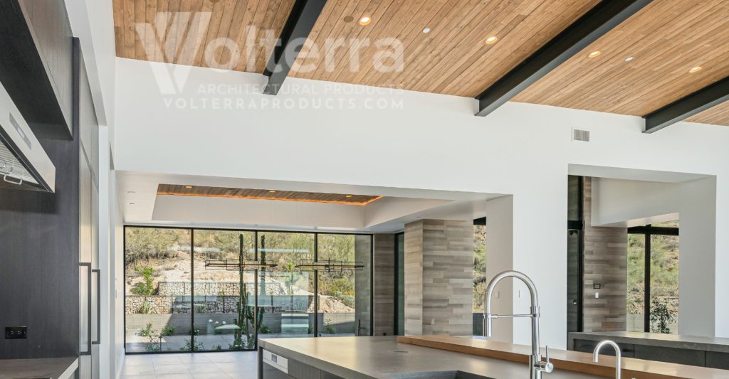 Wooden beam ceilings in an open concept kitchen and dining area