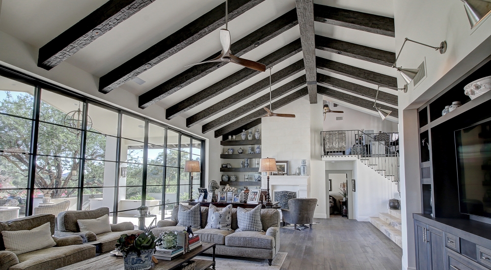 living room with wood beams on the ceiling